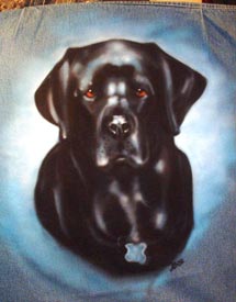 black lab portrait on denim jacket