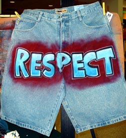 airbrush lettering on denim shorts